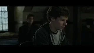 Young man deep in thought in dim room — The Social Network