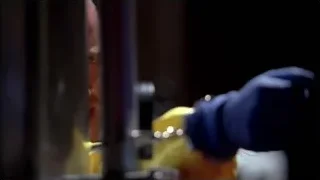 hand in blue glove holding yellow object — Breaking Bad