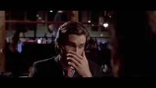 man in suit deep in thought — American Psycho