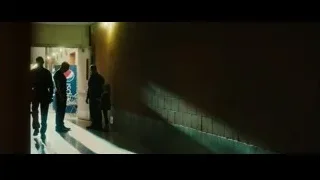 People walking in dimly lit hallway — Whiplash