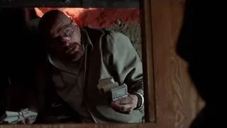 Bald man holding money in dark room — Breaking Bad