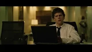 young man focused on laptop at desk — The Social Network