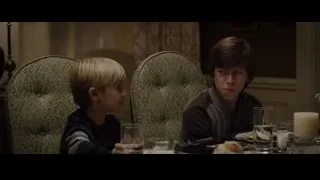 two boys at dining table in dim room — The Amazing Spider Man