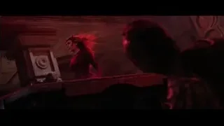 woman in red dress on eerie stone balcony — Doctor Strange 2