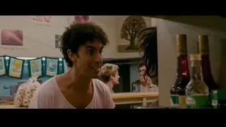 man with curly hair in kitchen — The Dictator