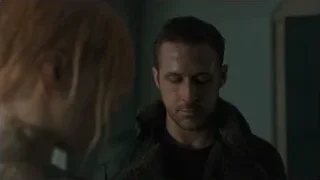 man and woman in dimly lit room — Blade Runner 2049
