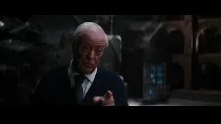 elderly man gesturing in dark stone room — Batman: The Dark Knight Rises