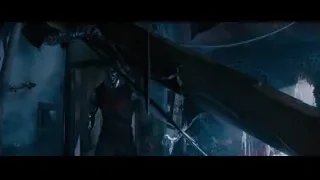 Dark room with debris and red weapon — Deadpool 2