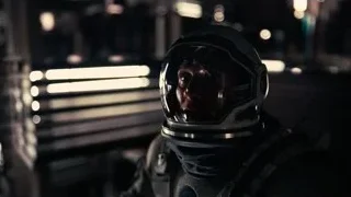 person wearing helmet in futuristic room — Interstellar