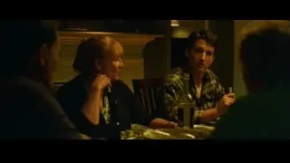 Young man explaining to others in dining room — Whiplash