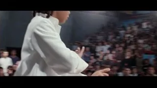 young girl in karate uniform with crowd — The Karate Kid