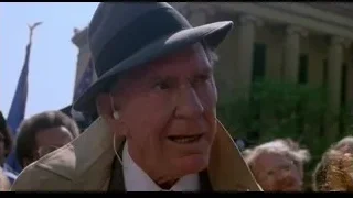 elderly man in fedora and trench coat outdoors — Rocky III