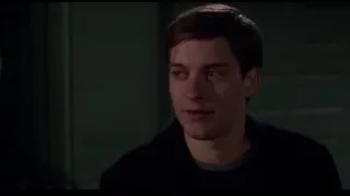 young man with dark hair serious expression — Spider Man