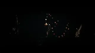 Silhouette of person dancing with colorful lights — Into the Wild