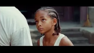 girl with braided hair and man's hand — The Karate Kid