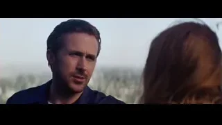 man and woman facing in cityscape — La La Land