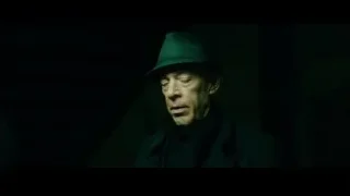 man in green top hat in spotlight — Whiplash