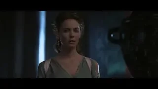 woman in green dress in blue lit room — Gladiator