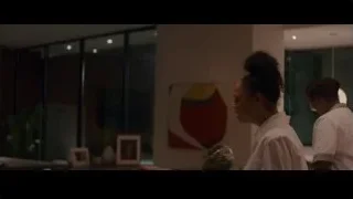 young woman standing in dimly lit room — Creed 3