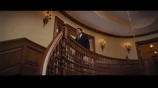 man and woman in hallway with arched windows — The Wolf Of Wall Street