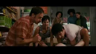 man bending over woman in store — The Dictator
