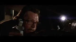 man holding a gun close-up — Batman