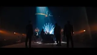 stage with musicians and spinning propellers — John Wick: Chapter 4