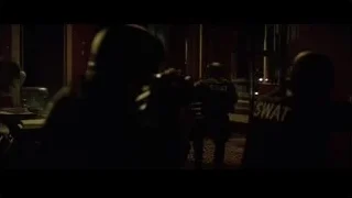 SWAT officers in dimly lit hallway — Batman