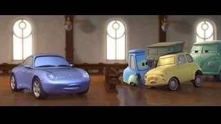 smiling Cars characters parked in a room — Cars