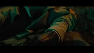 Man sitting in dimly lit room with lanterns — John Wick: Chapter 4