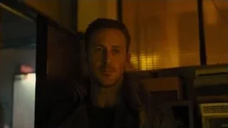 close-up of man's serious face in dark room — Blade Runner 2049