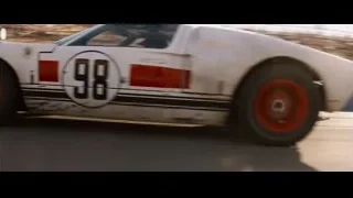 Race car driving fast on track — Ford v Ferrari