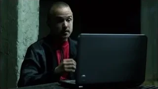 Bald man sitting with laptop in dark room — Breaking Bad