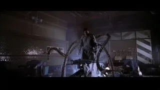 Man with large snake in dark cluttered room — Spider Man 2
