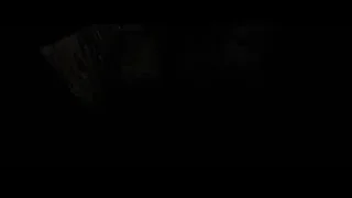 man in suit holding flashlight in dark — Batman: The Dark Knight Rises