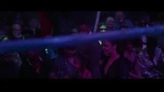 person singing into microphone at nightclub — Creed 3