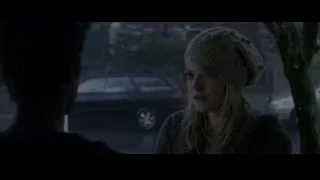 woman in beanie looking out window at night — The Amazing Spider Man