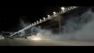 crashed car on race track at night — F1