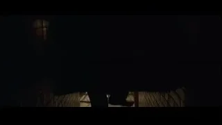 person walking through dark brick tunnel — Batman