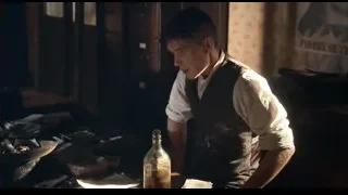 Young man in cluttered room with whiskey — Peaky Blinders