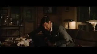 man in suit in dimly lit room — Ford v Ferrari
