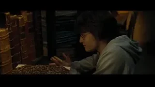 Young man reading book in dimly lit library — Harry Potter and the Goblet of Fire