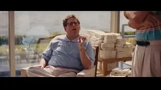 Man deep in thought by ocean view window — The Wolf Of Wall Street