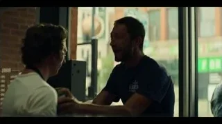 two men talking in front of store — The Bear