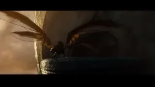 Person standing in cave with fire — Superman: Man of Steel