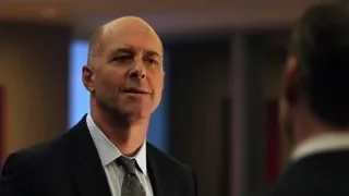 bald man in suit speaking to man — Suits