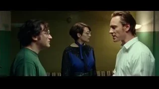 Three people in green room with striped couch — Steve Jobs