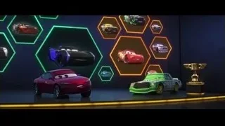 Red and green cars on stage with trophy — Cars 3