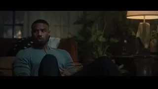 Man's close-up face, eyes closed in dim room — Creed 2