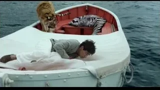 Man and tiger on red boat — Life of Pi